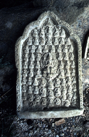 Tsa-tsa (the buddha's ashes made shape as pagoda) sleeps quietly at the shade of the rock.